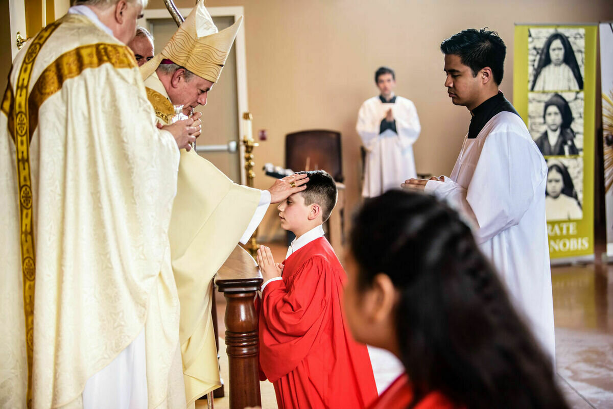 sacrament of confirmation laying on of hands